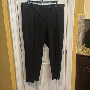 Lightweight dress slacks. Has pockets in front and back Wide belt loops..